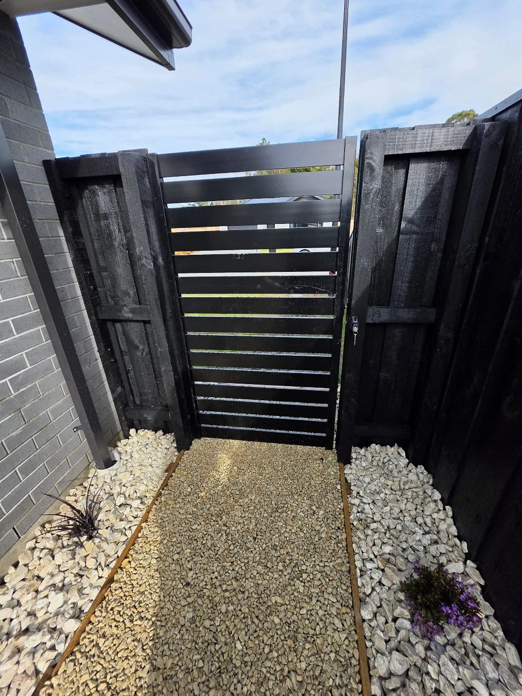 Landscaping and fencing detail at 25 Derbridge Street, Christchurch